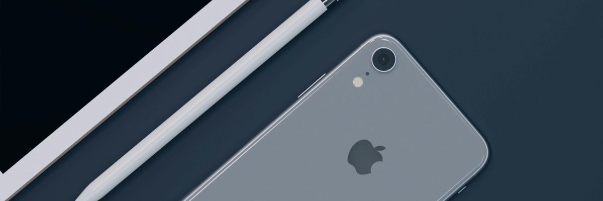 Sleek design of Apple iPhone, iPad, and Pencil highlighting modern technology.